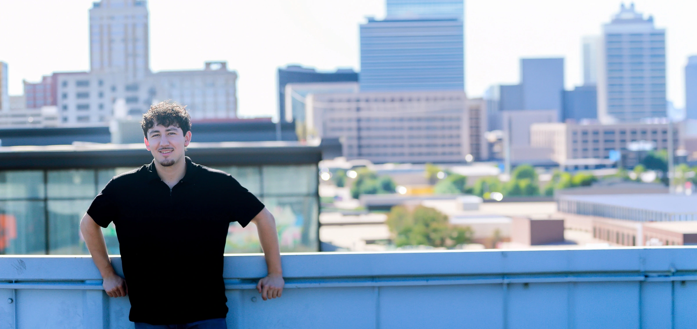 Ulisses Costeira with Tulsa downtown skyline
